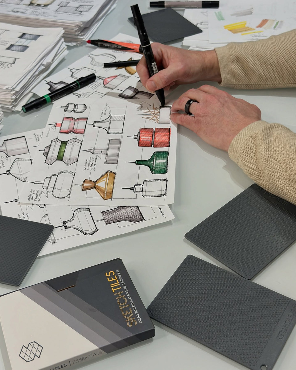 Adding texture to a page of coloured product studies by Carter McGuyer