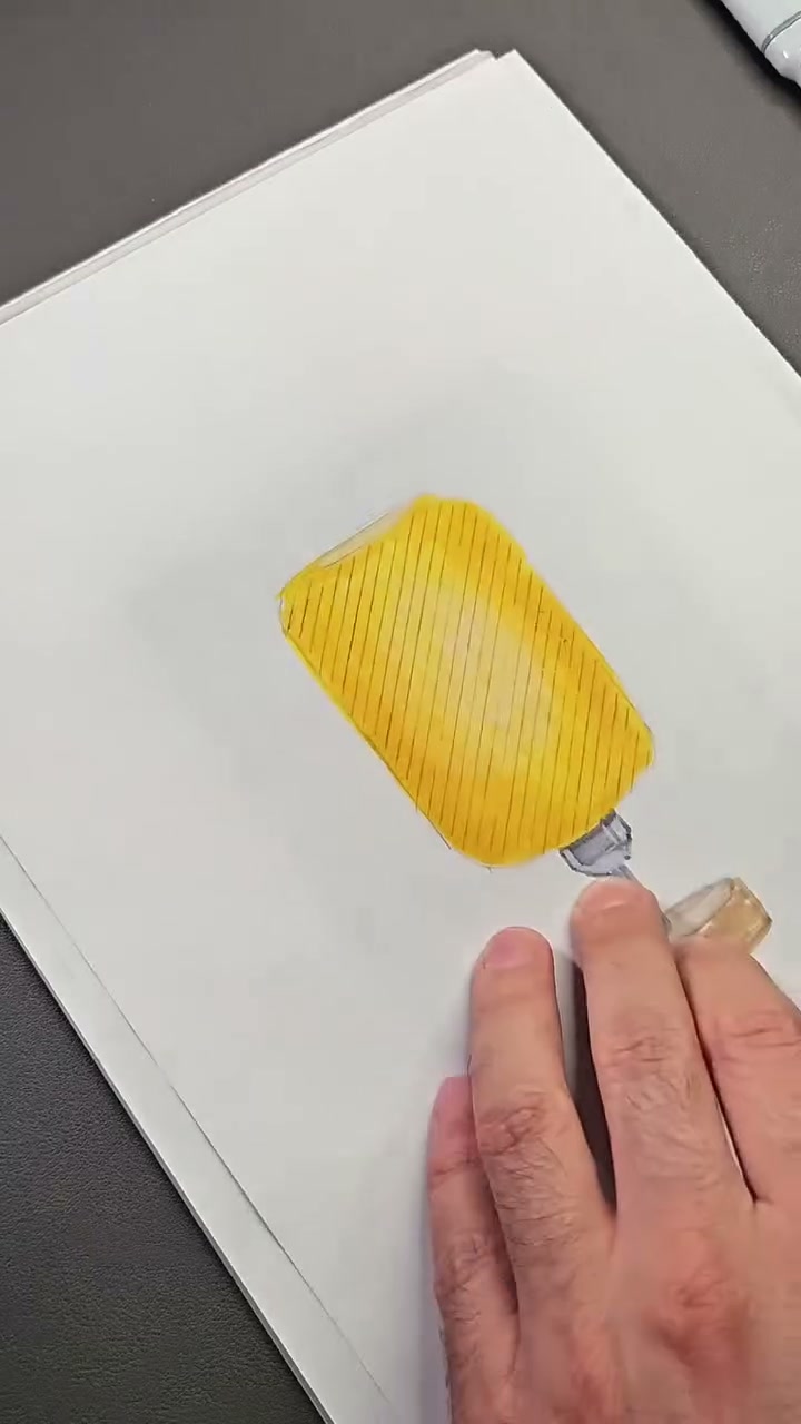 Yellow lampshade after the first pencil pass, with lines running in one direction.