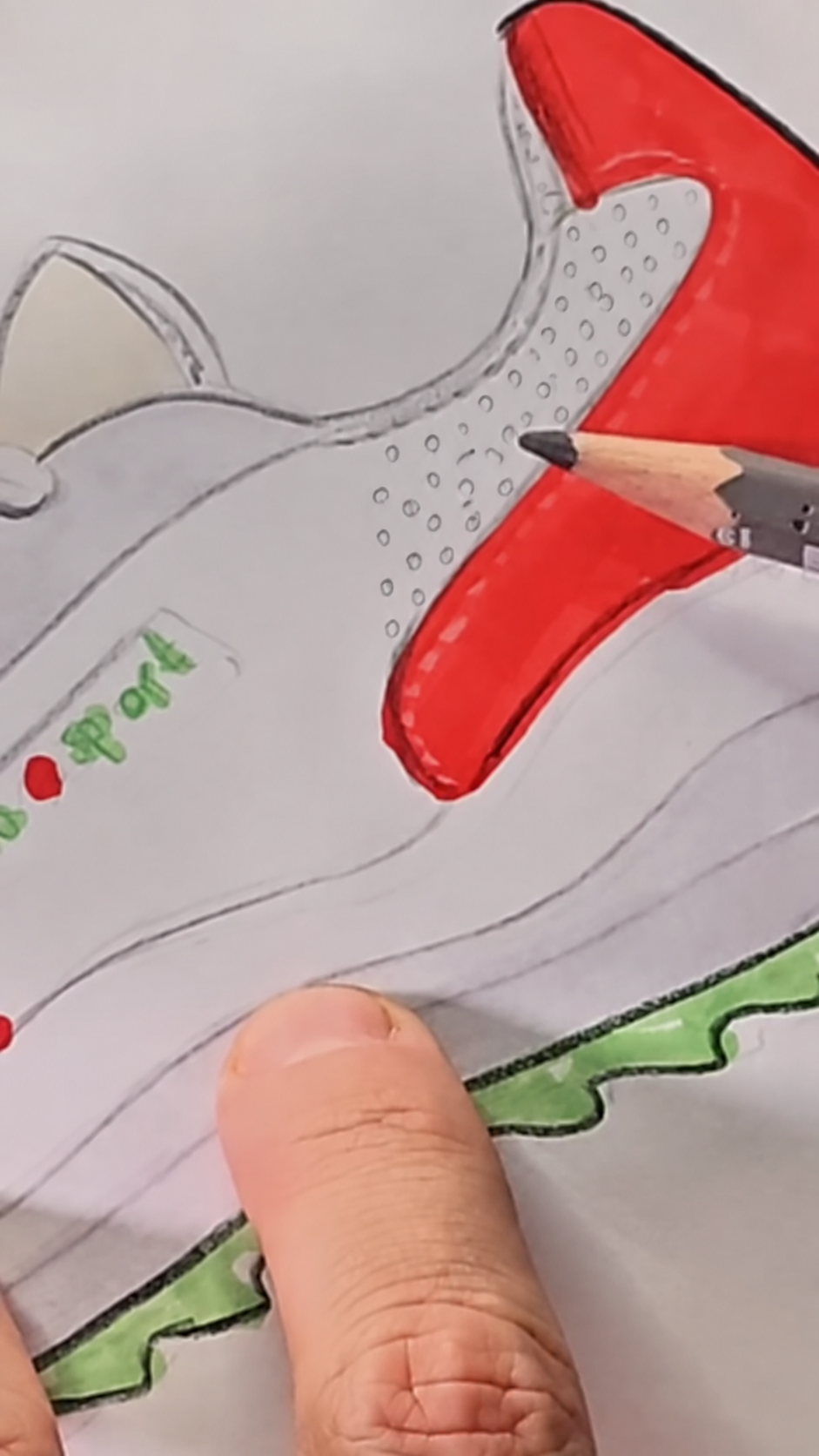 Individual pencil loops forming mesh texture on the pale sneaker panel.